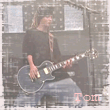 tom a la guitare